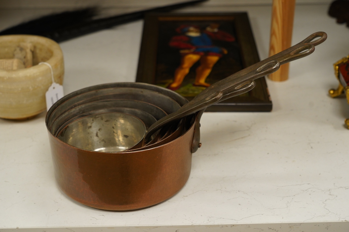 A set of five graduated copper pans, largest diameter 21cm. Condition - fair to good